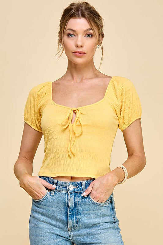 KNIT FRONT WITH TIE MID RISE CROP TOP