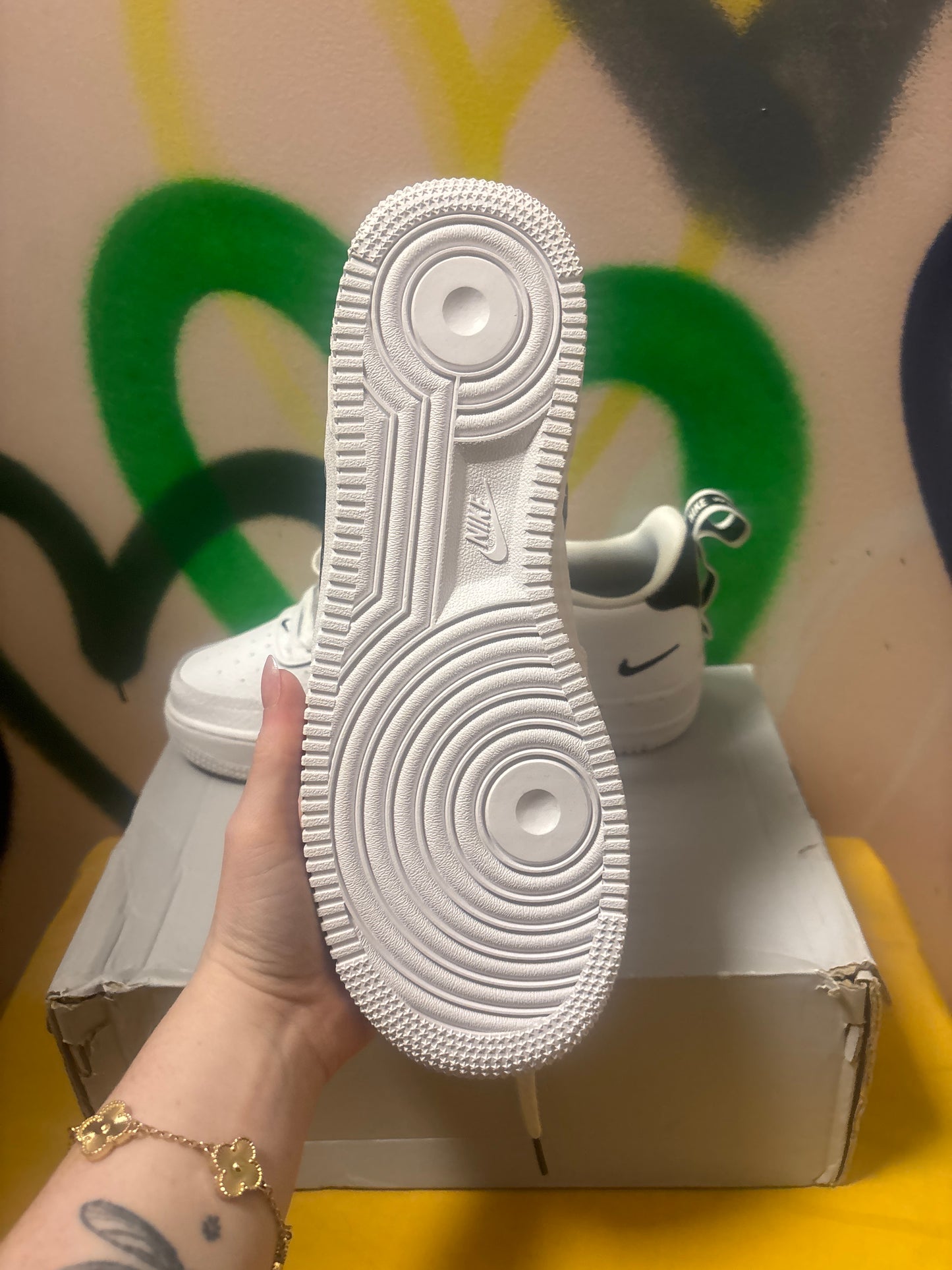 white Nike Air Force 1 LV8 Utility sneakers feature black swooshes and branding accents Size 6 Youth